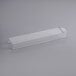 A clear plastic rectangular container with a long white rectangular handle.