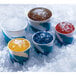 A group of ice cream cups with flake ice in them on a white background.