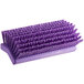 A close-up of a Carlisle Sparta purple floor scrub brush with bristles.