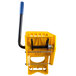 A yellow plastic Lavex wringer attachment for mop buckets.