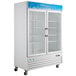 An Avantco white swing glass door merchandiser freezer.