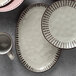 A group of Libbey gray stoneware platters.