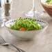 A close-up of a Libbey Dulcet stoneware bowl filled with salad.