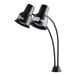 An Avantco black dual arm heat lamp with curved metal poles.