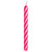 A pink and white striped Creative Converting spiral candle.
