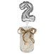 A silver balloon with the number two on it.