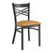 A black Lancaster Table & Seating metal chair with a light brown vinyl padded seat.