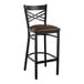 A Lancaster Table & Seating black cross back bar stool with a dark brown cushioned seat.