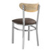 A Lancaster Table & Seating metal chair with a dark brown seat cushion.