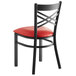 Lancaster Table & Seating Black Finish Cross Back Chair with 2 1/2" Red Vinyl Padded Seat Main Thumbnail 4