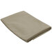 A folded beige Intedge table cover.