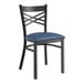 A Lancaster Table & Seating black metal chair with a navy blue cushion.