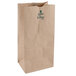 A close up of a brown Duro paper bag with green text.