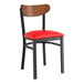 A black Lancaster Table & Seating chair with red vinyl seat and antique walnut back.