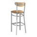 A Lancaster Table & Seating bar stool with a light brown vinyl seat and driftwood back.