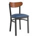 A Lancaster Table & Seating black chair with a navy vinyl seat and wooden back.
