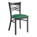 A Lancaster Table & Seating black cross back chair with green vinyl padded seat.