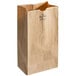 A close up of a Duro brown paper bag with a white background.