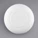 A white Elite Global Solutions melamine coupe bowl with a white circle on the rim.