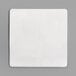 A white square paper pad on a gray surface.