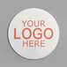 A white round coaster with red customizable text that says "your logo here"