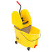 A yellow Rubbermaid mop bucket with a handle and a gray bucket inside.