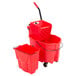 A red Rubbermaid mop bucket with a red side press wringer and a red dirty water bucket.