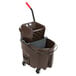 A brown Rubbermaid mop bucket with a side press wringer and a gray dirty water bucket.
