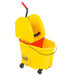 A yellow Rubbermaid WaveBrake mop bucket with a handle.