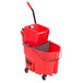 A Rubbermaid red mop bucket with a side press wringer and gray dirty water bucket.
