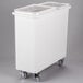 A white plastic Cambro ingredient storage bin with clear sliding lids on wheels.