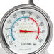 A close up of a Taylor refrigerator/freezer thermometer with a red and blue dial.