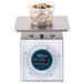 An Edlund Four Star portion scale with a bowl of nuts on it.