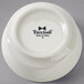 A white Tuxton china bowl with an embossed rim.