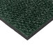 A close-up of a Cactus Mat vibrant sea green berber carpet mat with black edges.