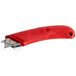 A red Pacific Handy Cutter left-hand safety knife with a rectangular label.
