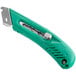 A green Pacific Handy Cutter right-hand safety cutter with a silver blade.