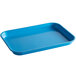 A blue rectangular plastic tray with handles by Cambro.