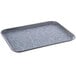 A Dinex Glasteel rectangular fiberglass tray with a gray marble speckled surface.