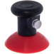 A red and black plastic round suction base with a silver knob.