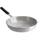 A Choice aluminum frying pan with a black silicone handle.