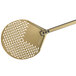 A close-up of a GI Metal gold anodized aluminum round perforated pizza peel with a long handle.