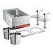 An Avantco stainless steel countertop food cooker and warmer with 2 insets and 2 condiment pumps.