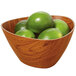 A triangular faux wood bowl filled with limes.