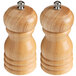 Two Acopa wooden salt and pepper mills with metal caps.