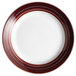 A close-up of a white Libbey porcelain plate with brown apple butter stripes.
