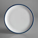 A white porcelain plate with a steel blue rim.