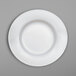A close-up of a white Villeroy & Boch bone porcelain plate with a thin rim.