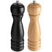 Two Acopa wooden pepper mills with black bases and natural wooden handles.