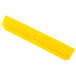 A yellow Carlisle Sparta Omni Sweep push broom head with bristles.